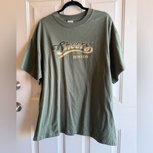Cheers Boston 2007 CBS “ Normisms” T Shirt Olive Green & Yellow Print XL Cotton